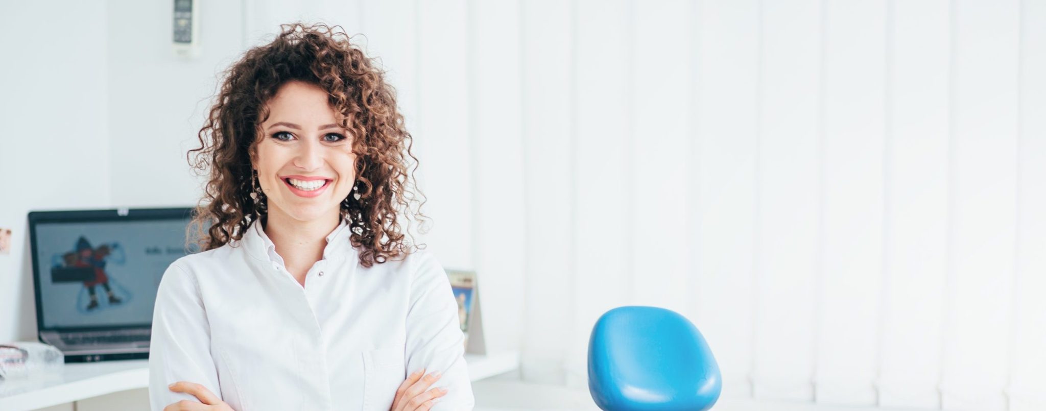 Portrait,of,female,dentist.,she,standing,at,her,office,and