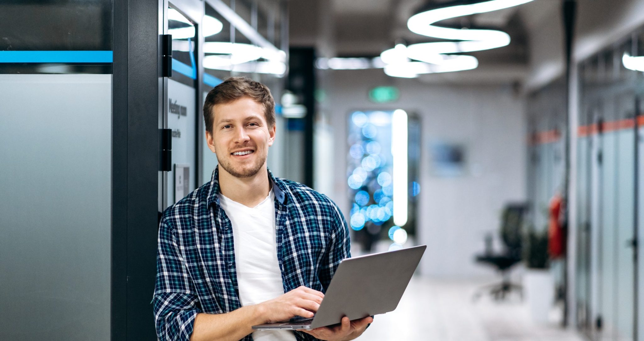 Caucasian,guy,freelancer,with,laptop.,a,successful,guy,dressed,in